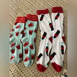 Two pairs of socks! Red solo cups light blue background and cola glasses!